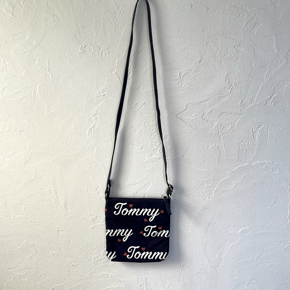 Navy blue Tommy Hillfigure crossbody purse.